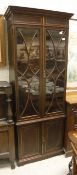 An Edwardian mahogany and inlaid bookcase cabinet,