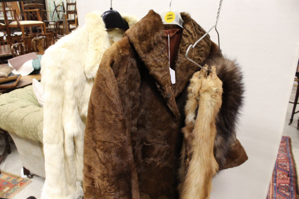 A dyed white rabbit fur jacket together with a further brown fur coat,