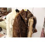A dyed white rabbit fur jacket together with a further brown fur coat,