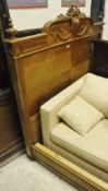 A walnut bedstead together with an oak framed bergere chair with floral upholstered back