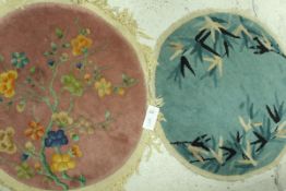 A pair of Chinese 1920's circular rugs, one of green colour with grass style design,