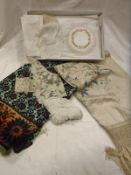 A box containing a Victorian cream silk shawl with embroidered floral decoration,