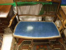 An Edwardian mahogany inlaid salon settee together with a reproduction mahogany serpentine fronted