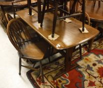 A mahogany Ercol dining table together with five Ercol stick back chairs together with two further