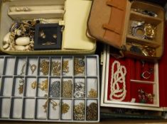 A box of assorted costume jewellery to include various chains, beaded necklaces, costume rings etc.