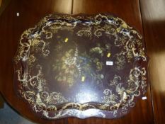 A Victorian painted and gilded lacquered papier-maché tray with central floral spray decoration