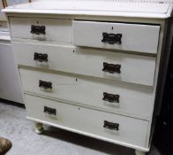 A cream painted pine chest of drawers,