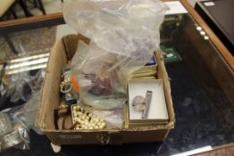 A box containing various costume jewellery, bone bead necklace and various other necklaces etc.