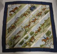 A Hermes silk scarf entitled "Sportsmen Racing Hunting Steeplechasing" and signed Ledoux