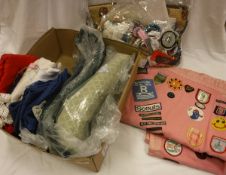 A box containing a Brownie/Scout camp blanket sewn with various badges from the 1970's onwards