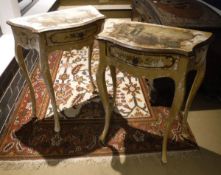 A pair of painted bedside tables with serpentine fronts,