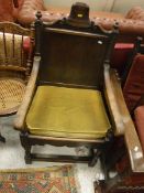 A Continental possibly Dutch panel seated elbow chair with bell decoration to the back together