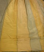 A pair of yellow silk type striped interlined curtains with fixed triple pinch pleat heading,