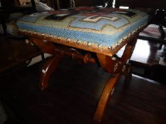 A Victorian walnut X framed stool with gold and silver incised star decoration,