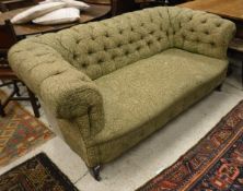 A Chesterfield sofa with green ground and floral upholstery