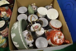 A box of various chinaware to include a selection of Hornsea mugs for each month of the year,