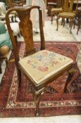 A set of six 1920's walnut dining chairs in the early 18th Century manner with needlework tapestry