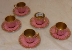 A set of five Royal Doulton cabinet cups and saucers,