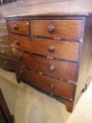 A Victorian mahogany bow-fronted chest of two short over three long drawers