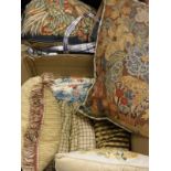 A collection of needlework type scatter cushions together with two velum suitcases and a further