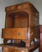 A modern walnut chest of four long drawers on bracket feet, a pine kitchen table,