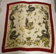 A Hermes silk scarf depicting squirrels within leaves and signed X De Poret CONDITION