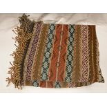 A middle eastern style throw of multi coloured striped design CONDITION REPORTS