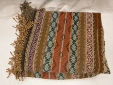 A middle eastern style throw of multi coloured striped design CONDITION REPORTS