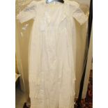 A Victorian cotton and lace children's christening robe together with two other babies gowns and a