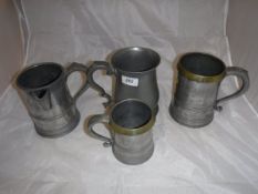 A collection of six various 19th Century pewter mugs and measures,