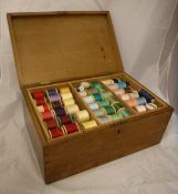 An early 20th Century oak workbox containing various vintage threads, to include Sylko,