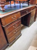 An early 20th Century oak partners desk,