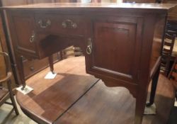 An Edwardian mahogany and inlaid dressing table with single drawer and two cupboard doors