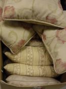 A box of assorted scatter cushions