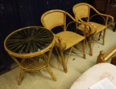 A wicker table with glass top and four matching chairs