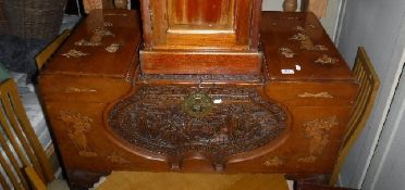 An Eastern carved camphor wood trunk