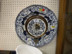 A circa 1900 Creil (Canadian) pottery wall plate clock, floral patterned,