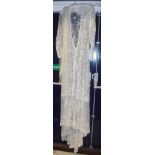 A circa 1900 lacework overdress with sleeves together with a net veil (2)