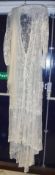 A circa 1900 lacework overdress with sleeves together with a net veil (2)
