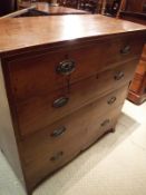 An early 19th Century mahogany and satinwood strung chest of two short over three long drawers