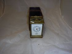 A circa 1900 French lacquered brass cased carriage clock with alarm,