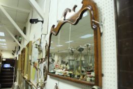 A 20th Century burr walnut veneered wall mirror in the 18th Century manner