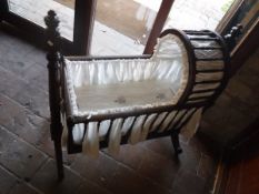 A 19th Century mahogany crib with mattress