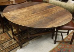 An oak drop leaf gate leg table with single drawer CONDITION REPORTS Numberous