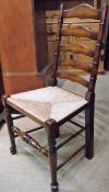 A set of six modern rush seat ladderback chairs in the 17th Century style on bobbin turned supports,