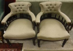 A pair of Victorian tub chairs with button backs,