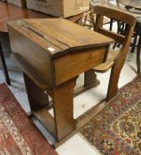 A pine school desk with integral chair