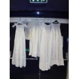 A collection of five 19th Century and later babies christening gowns and other dresses