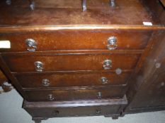 An early 20th Century oak chest on chest in the Georgian style