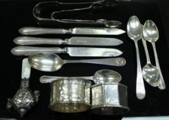 A collection of various small silver wares to include a pair of sugar nips (London 1827),